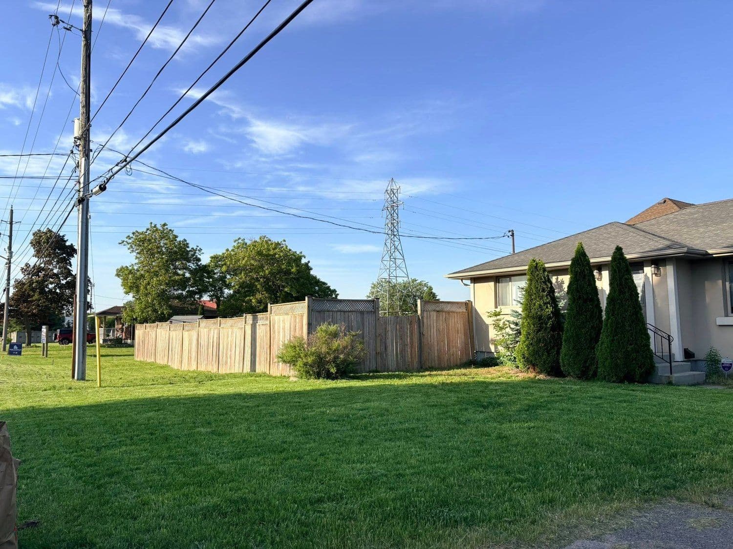 Trimmed front lawn and property maintained by Premium Property Care
